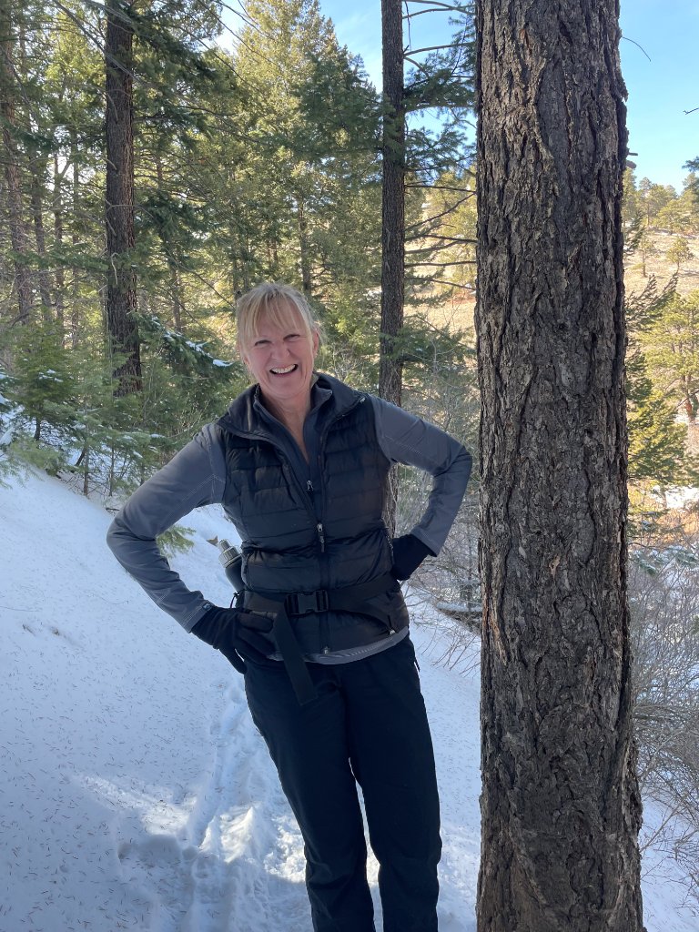 Katie B. Smith outdoors on a snowy Colorado trail